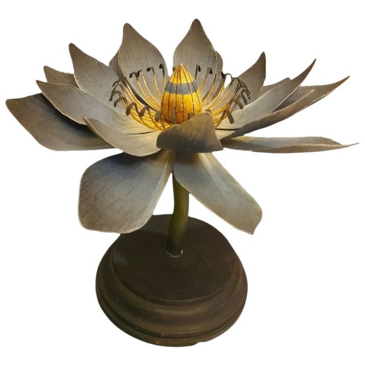 Painted metal water lily mounted on a wooden base