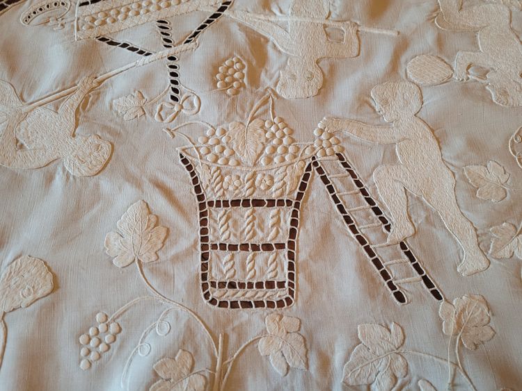 Embroidered pedestal tablecloth on the theme of grape harvests and wine, circa 1900