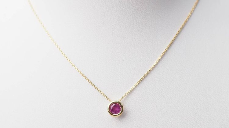 Yellow gold and ruby solitaire necklace