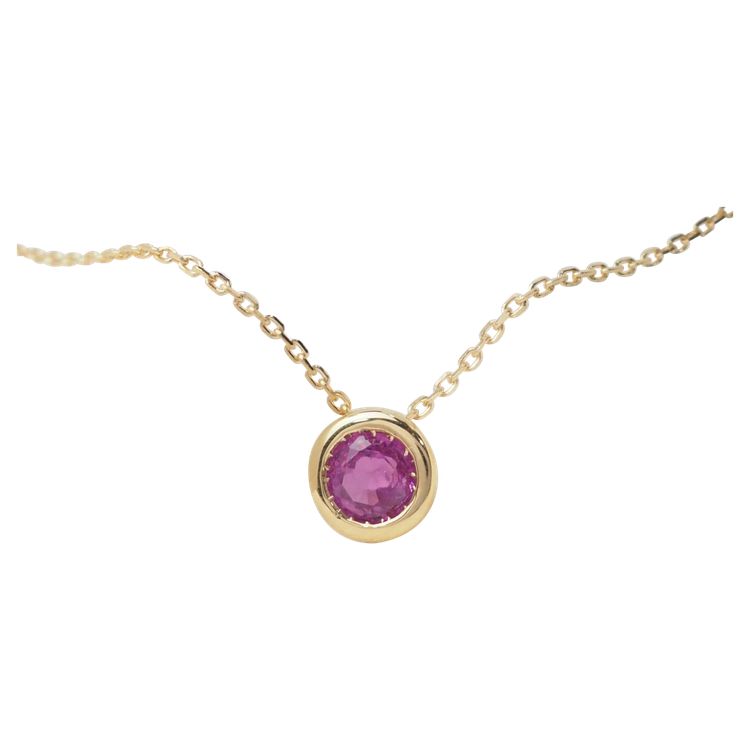 Yellow gold and ruby solitaire necklace