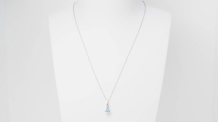 White gold and blue topaz solitaire necklace