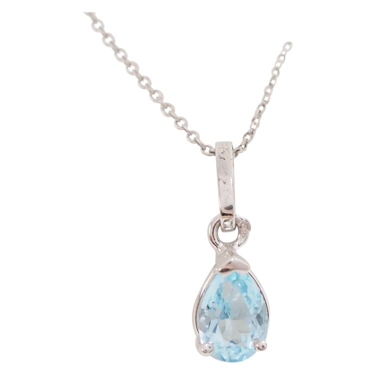 White gold and blue topaz solitaire necklace