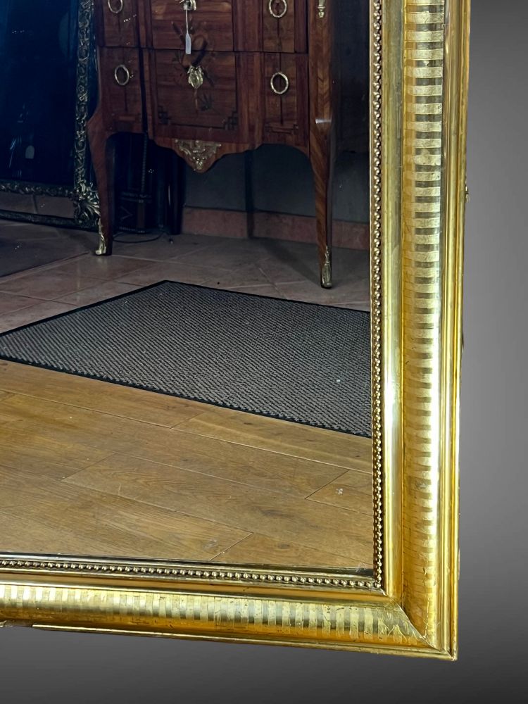 LARGE LOUIS PHILIPPE PERIOD MIRROR IN WOOD AND GILDED STUC (gilded leaf)