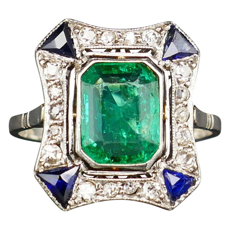 Art Deco ring set with a Colombian emerald (certificate), platinum.