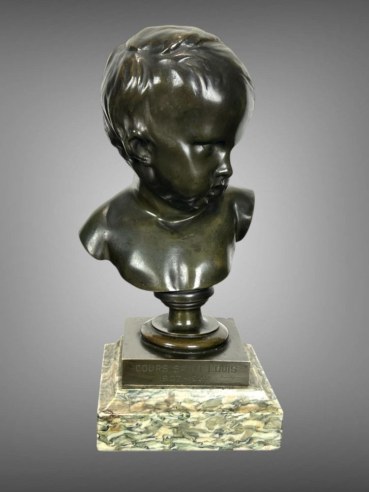 PATINATED BRONZE BUST OF A PUTTO AFTER FRANCOIS DUQUESNOY ON MARBLE BASE