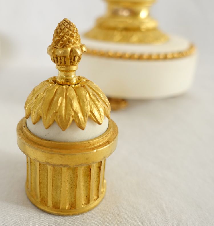 Pair of gilt bronze and marble cassolettes with upside-down candlesticks, Louis XVI style