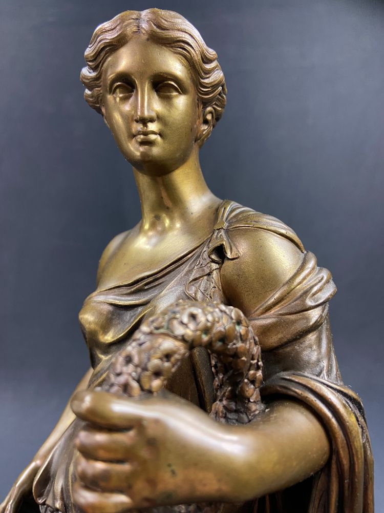 19th-century bronze sculpture of an antique woman with a foliage crown