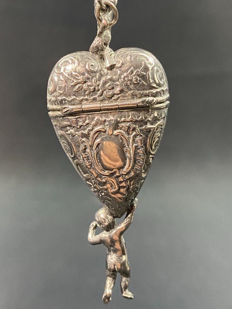 19th century Louis XV style solid silver reliquary pendant box with Putti decoration