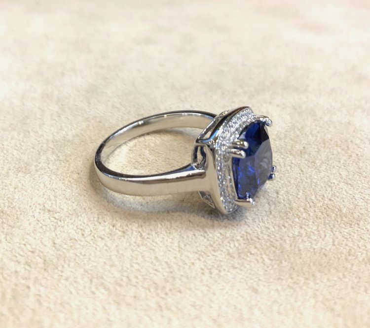 Blue stone and zircon ring