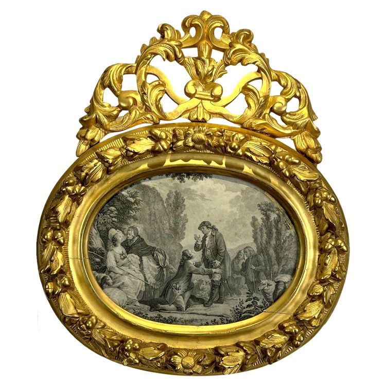 EIGHTEENTH CENTURY OVAL FRAME IN GILDED SCULPTTED WOOD AND ITS FURNACED FRONTIER