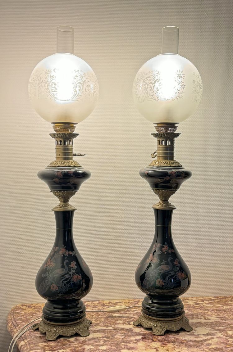 Pair of black opaline oil lamps with enamelled decoration of peacocks and flowers