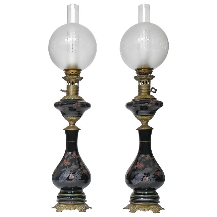 Pair of black opaline oil lamps with enamelled decoration of peacocks and flowers