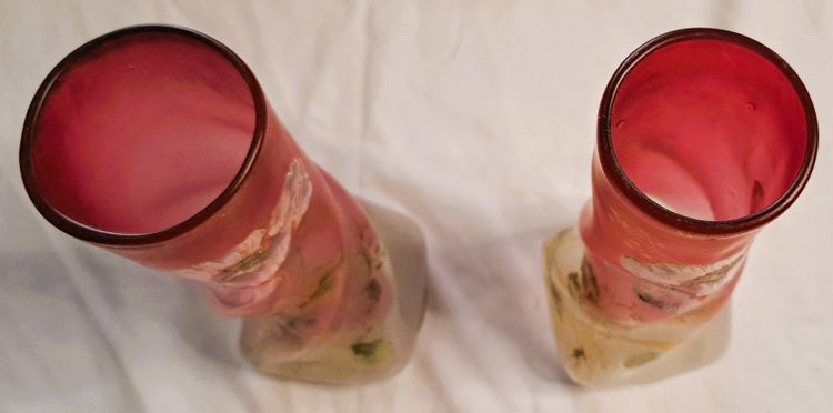 Pair of François Théodore Legras vases in enamelled twisted glass on a pink background with floral decoration, early 20th century