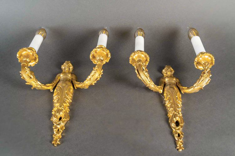 A pair of Louis XVI style Aux Termes de Femmes sconces in chiseled and gilt bronze circa 1850-1870