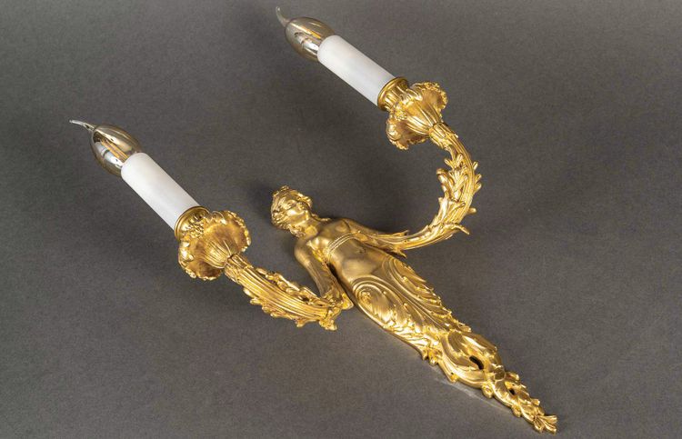 A pair of Louis XVI style Aux Termes de Femmes sconces in chiseled and gilt bronze circa 1850-1870