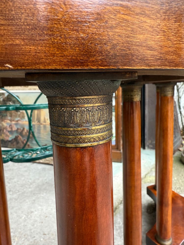 Pair of Empire style mahogany pedestal tables, veined marble top