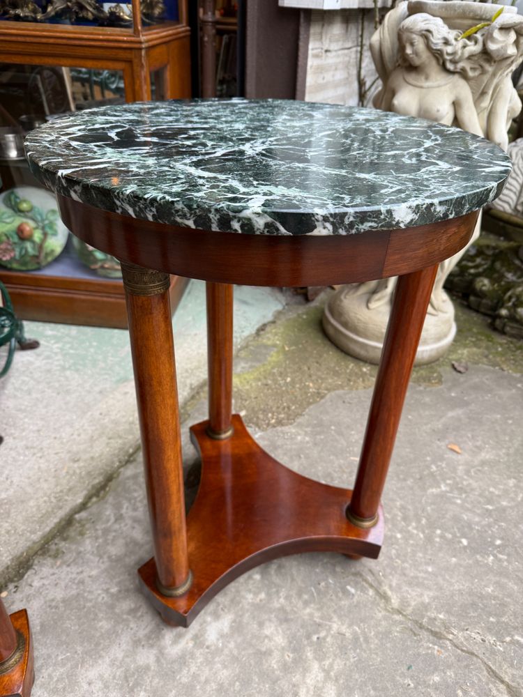 Pair of Empire style mahogany pedestal tables, veined marble top