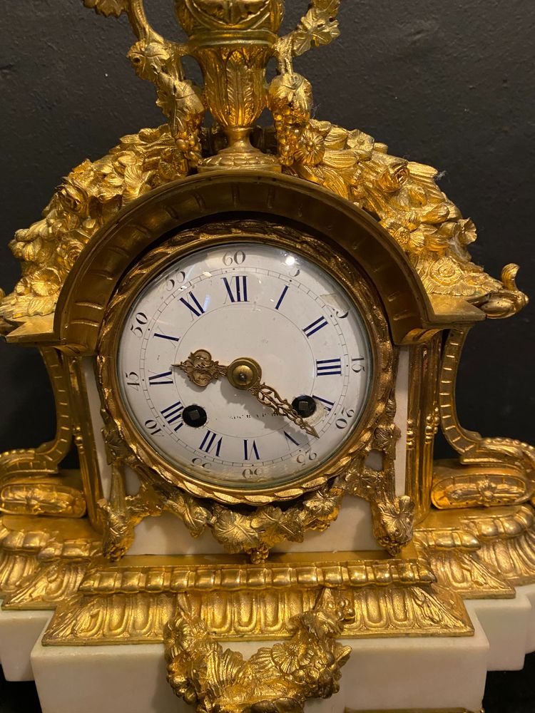 Louis XVI clock in marble and gilded bronze