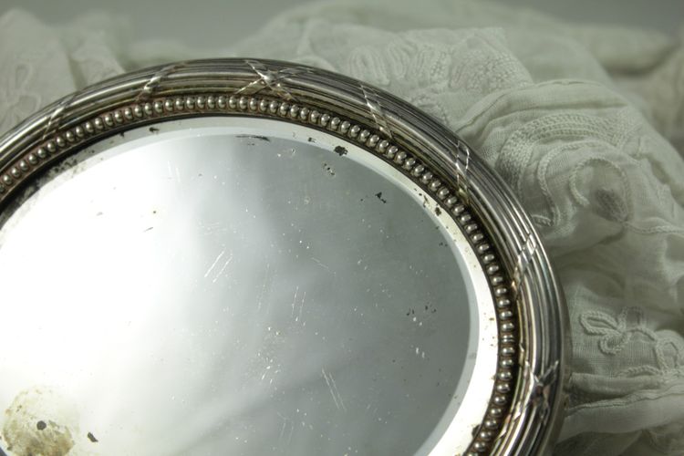 Small oval beveled mirror with solid silver frame circa 1900