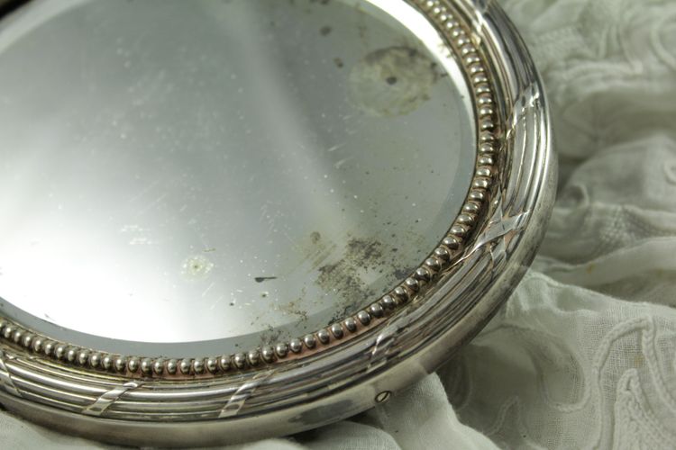 Small oval beveled mirror with solid silver frame circa 1900