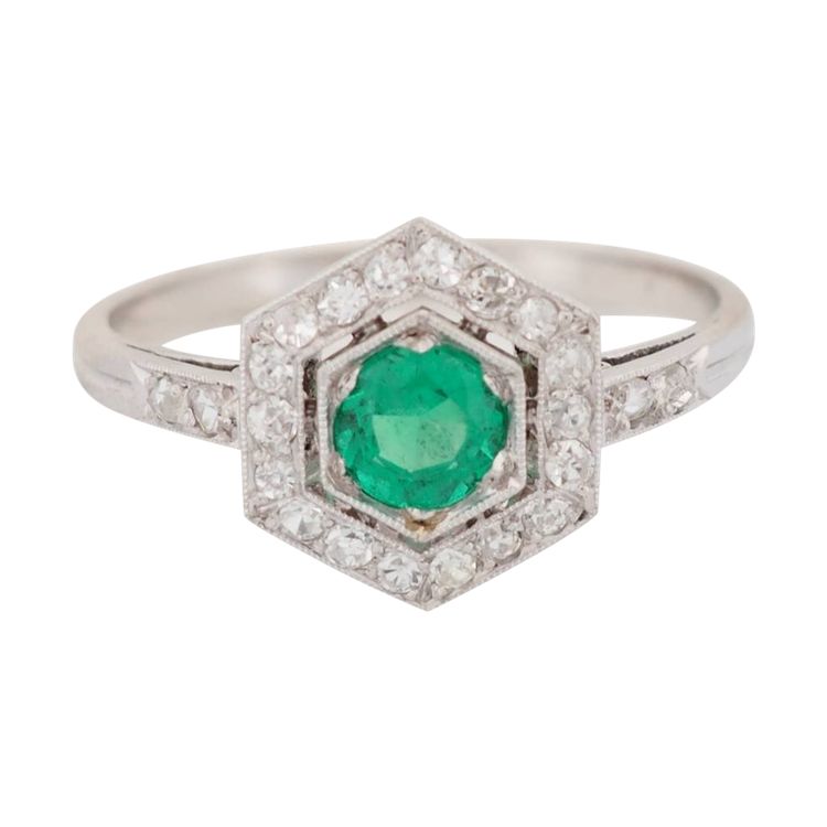 Hexagonal ring in platinum, emerald and diamonds