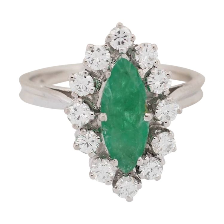 Marquise ring in white gold, emerald and diamonds