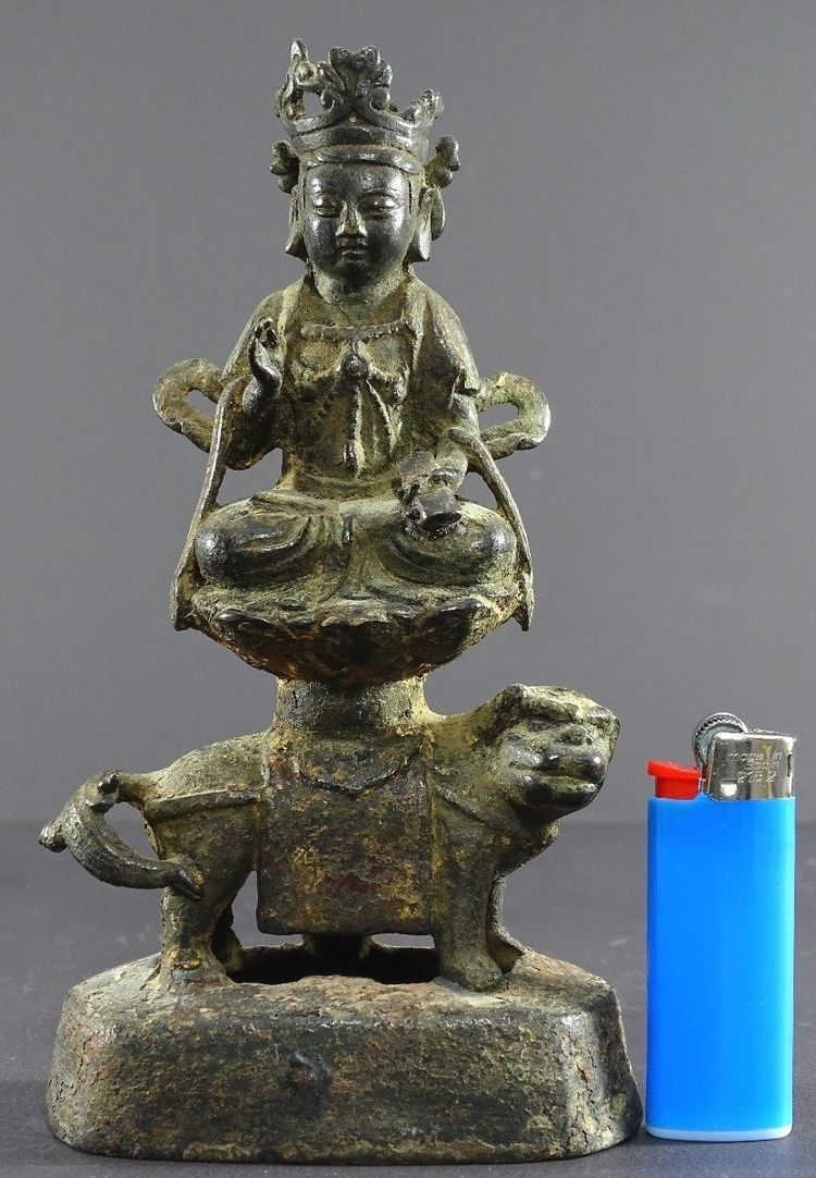 China, Ming Dynasty, Late 14th-early 15th century, Bronze Statuette of Majushri on a Lion.