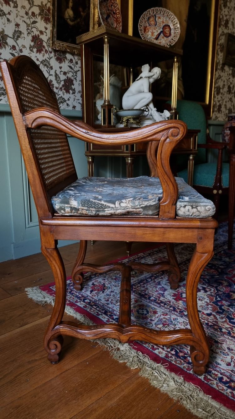 Pair of Louis XIV style caned armchairs. Late 19th century.