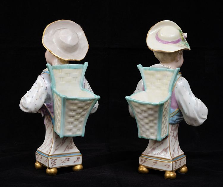 Pair of porcelain flower-bearing sculptures, Germany, early 20th century.