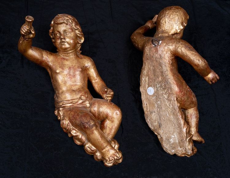 Pair of antique single-trunk cherubs in gilded wood. Florence, late 17th century.