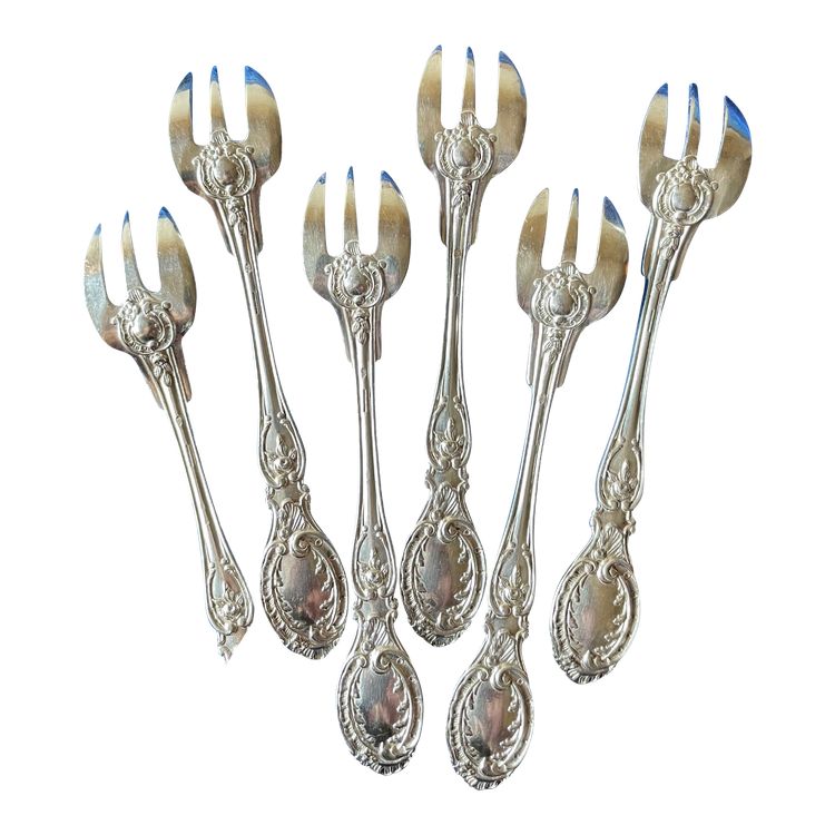 6 oyster forks.