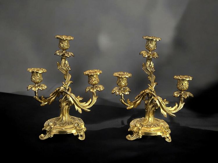 PAIR OF LATE 19TH CENTURY GILT-BRONZE THREE-BRANCH CANDLESTICKS IN LOUIS XV STYLE