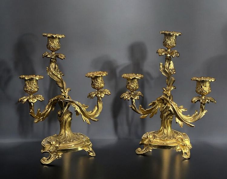 PAIR OF LATE 19TH CENTURY GILT-BRONZE THREE-BRANCH CANDLESTICKS IN LOUIS XV STYLE