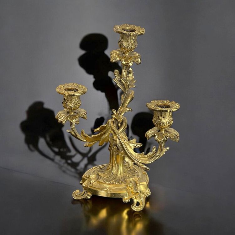 PAIR OF LATE 19TH CENTURY GILT-BRONZE THREE-BRANCH CANDLESTICKS IN LOUIS XV STYLE