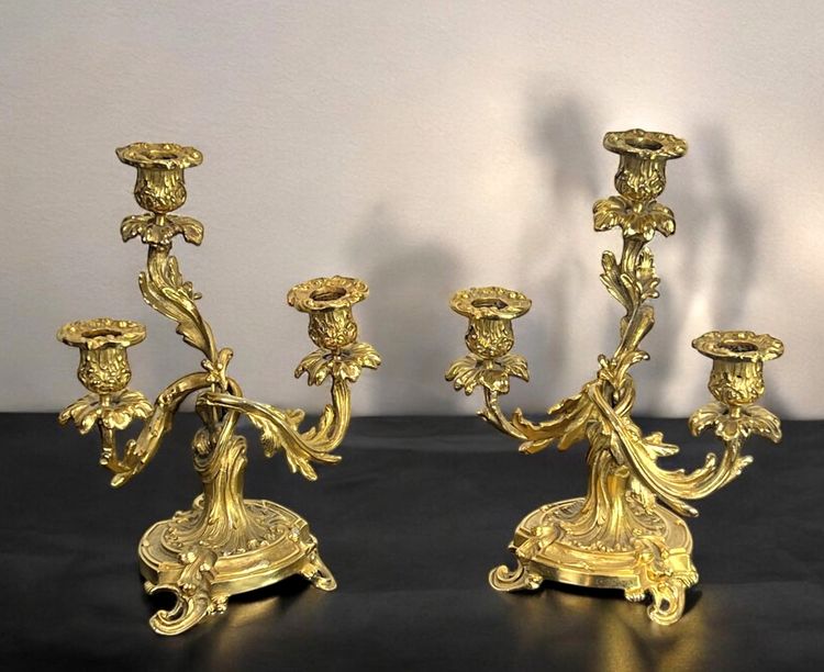 PAIR OF LATE 19TH CENTURY GILT-BRONZE THREE-BRANCH CANDLESTICKS IN LOUIS XV STYLE