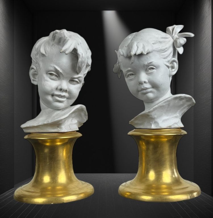 PAIR OF BISQUE CHILDREN'S BUSTS SIGNED BRUNO MERLI ON PORCELAIN BASE