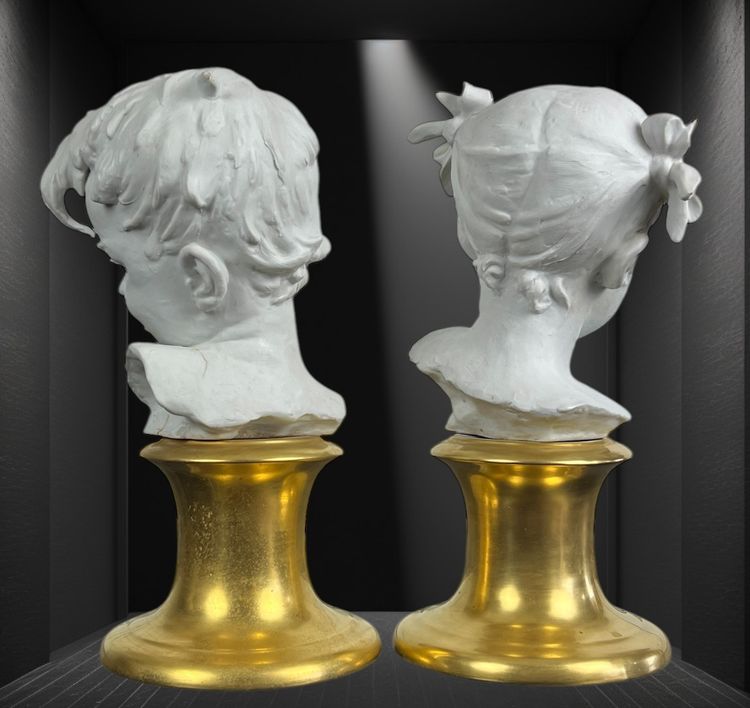 PAIR OF BISQUE CHILDREN'S BUSTS SIGNED BRUNO MERLI ON PORCELAIN BASE