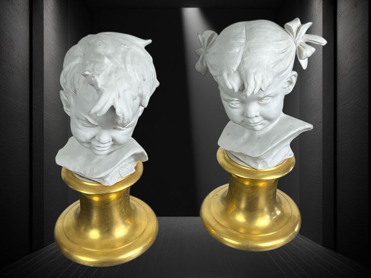 PAIR OF BISQUE CHILDREN'S BUSTS SIGNED BRUNO MERLI ON PORCELAIN BASE