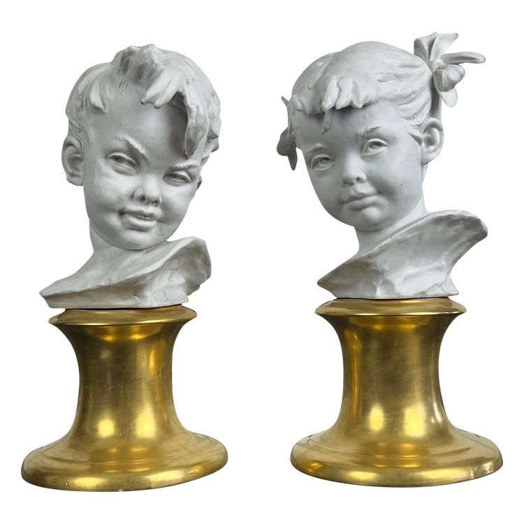 PAIR OF BISQUE CHILDREN'S BUSTS SIGNED BRUNO MERLI ON PORCELAIN BASE