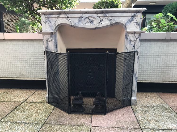 Small antique faux marble painted wood mantel from the late 19th century