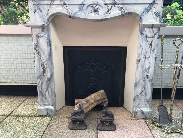 Small antique faux marble painted wood mantel from the late 19th century