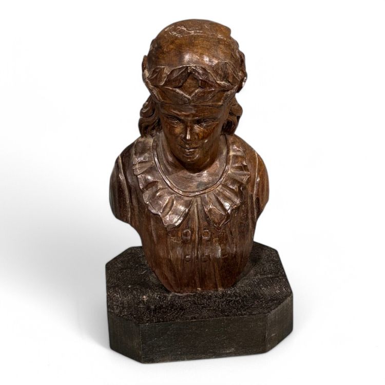 Carved wooden half-bust