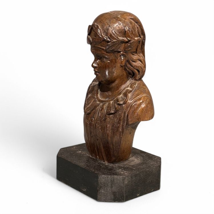 Carved wooden half-bust