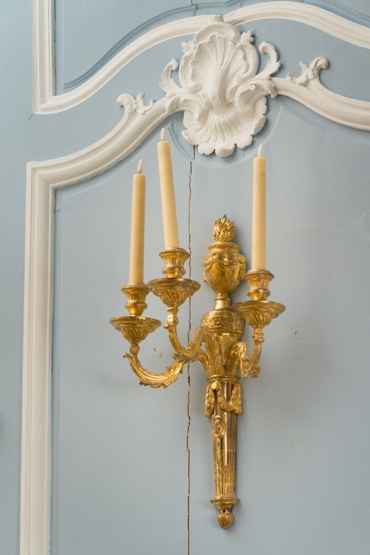 Pair of Louis XVI period gilt and chased bronze wall lights