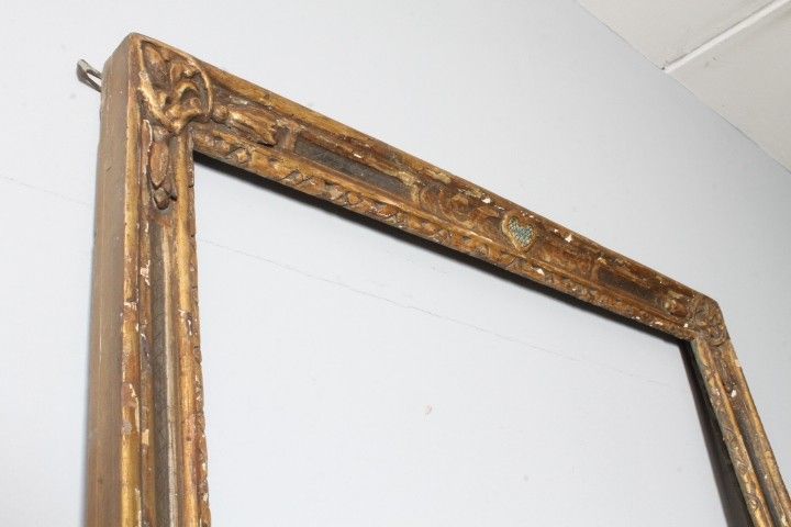 Antique large frame from the 1750s. Gilded and painted with carvings. Size 215 x 98