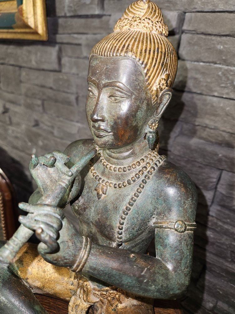 Statuette of Buddha playing the flute - Bronze - Early 20th century -