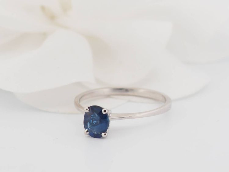 White gold and oval sapphire solitaire ring