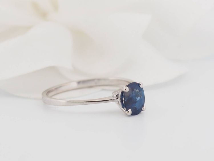 White gold and oval sapphire solitaire ring