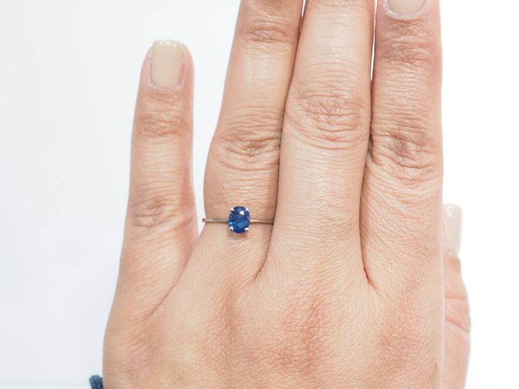 White gold and oval sapphire solitaire ring