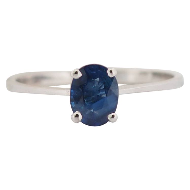 White gold and oval sapphire solitaire ring